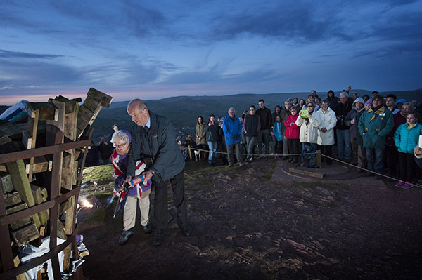 A birthday beacon for the Queen's 90th lit by a fellow 90 yr old - Elsie Christie, 90 from Marple, is assisted by Cllr John Brook as they light the birthday beacon atop Eccles Pike, Chapel-en-le-Frith - Thusrday 21 April 2016.